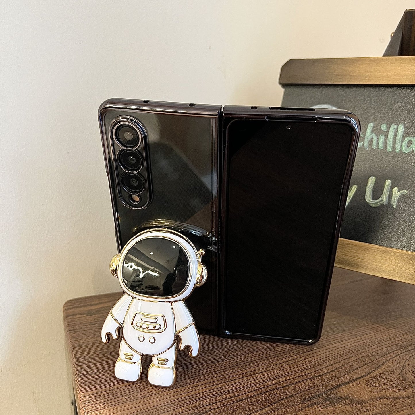 Fashionable Astronaut Stand Phone Case for Samsung Galaxy Z Fold 4 and Galaxy Z Fold 3.